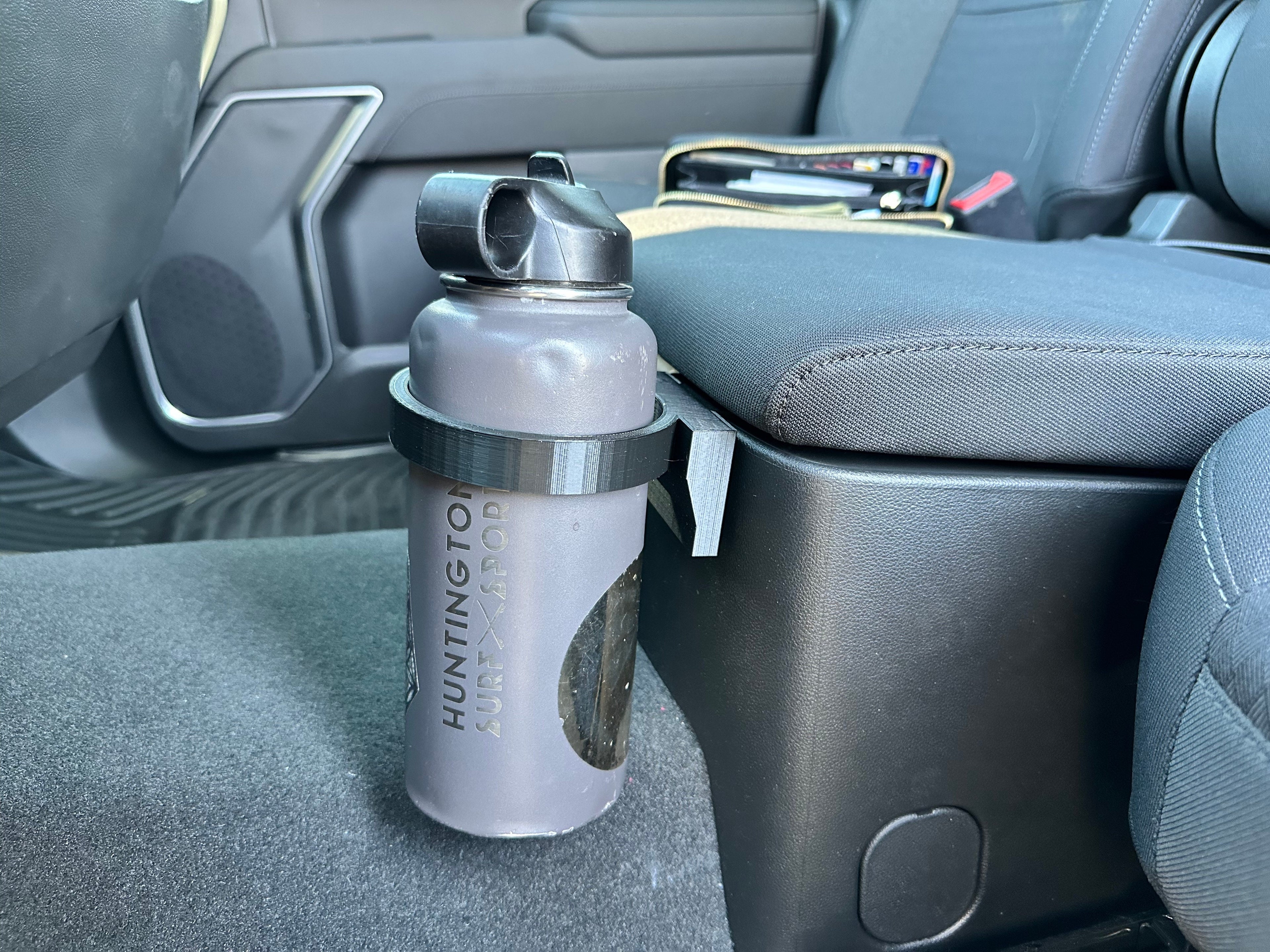 Load video: Bottle Amigo bottle holder in a 2023 Chevy Silverado.